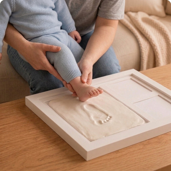 Step 2 · pressing baby hand into clay
